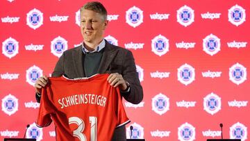 Chicago Fire new midfielder Bastian Schweinstiger holds up his new jersey after officially being introduced during a news conference on March 29, 2017 in Chicago, Illinois. 