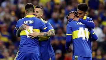 Boca Juniors' forward Dario Benedetto (2-L) celebrates with his teammate forward Martin Payero (L) after scoring a goal against Aldosivi during their Argentine Professional Football League Tournament 2022 match at La Bombonera stadium in Buenos Aires, on October 9, 2022. (Photo by ALEJANDRO PAGNI / AFP) (Photo by ALEJANDRO PAGNI/AFP via Getty Images)