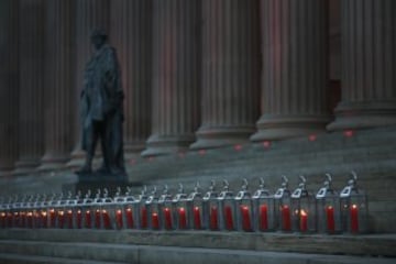 Candles and flowers on the steps of St George's Hall, Liverpool.