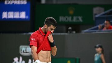 Serbia's Novak Djokovic reacts during his quarter-final men's singles match against Belgium's Zizou Bergs at the Shanghai Masters tennis tournament in Shanghai on October 9, 2025. (Photo by HECTOR RETAMAL / AFP)