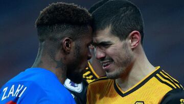 Crystal Palace's Ivorian striker Wilfried Zaha (L) remonstrates with Wolverhampton Wanderers' English defender Conor Coady during the English Premier League football match between Crystal Palace and Wolverhampton Wanderers at Selhurst Park in so