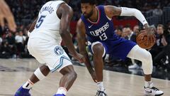 LOS ANGELES, CALIFORNIA - MARCH 12: Paul George #13 of the LA Clippers dribbles in front of Anthony Edwards #5 of the Minnesota Timberwolves during a 118-100 Timberwolves win at Crypto.com Arena on March 12, 2024 in Los Angeles, California.   Harry How/Getty Images/AFP (Photo by Harry How / GETTY IMAGES NORTH AMERICA / Getty Images via AFP)