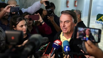 FILE PHOTO: Brazil's former President Jair Bolsonaro speaks with media as he arrives at the airport in Rio de Janeiro, on the day the Electoral Justice continues the trial to determine his political rights, Brazil June 29, 2023. REUTERS/Pilar Olivares/File Photo