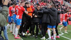 Girona players celebrte their second goal during the Spanish league football match between Girona FC and Valencia CF at the Montilivi stadium in Girona on December 1, 2023. (Photo by LLUIS GENE / AFP)