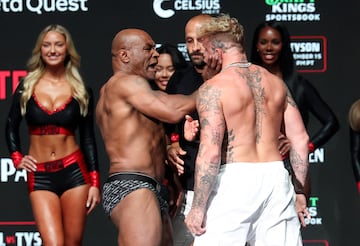 Mike Tyson slaps Jake Paul after weighing in.