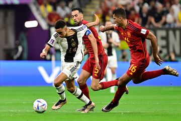 Germany's Musiala (left) with Rodri on his tail.