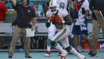 MIAMI, FL - SEPTEMBER 23: Jakeem Grant #19 of the Miami Dolphins scores a touchdown during the third quarter against the Oakland Raiders at Hard Rock Stadium on September 23, 2018 in Miami, Florida.   Marc Serota/Getty Images/AFP
 == FOR NEWSPAPERS, INTERNET, TELCOS &amp; TELEVISION USE ONLY ==