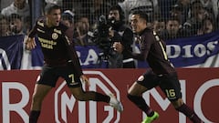 Universitario's forward Alexander Succar (L) celebrates after scoring a penalty kick against Gimnasia y Esgrima during the Copa Sudamericana group stage first leg football match between Gimnasia y Esgrima La Plata and Universitario, at the Estadio del Bosque stadium in La Plata, Argentina on April 5, 2023. (Photo by JUAN MABROMATA / AFP)