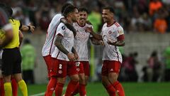 Internacional's Spanish defender Hugo Mallo (2nd-L) celebrates with teammates after his goal was validated after a VAR (Video Assistant Referee) review during the all-Brazilian Copa Libertadores semifinals first leg football match between Fluminense and Internacional, at the Maracana stadium, in Rio de Janeiro, Brazil on September 27, 2023. (Photo by MAURO PIMENTEL / AFP)