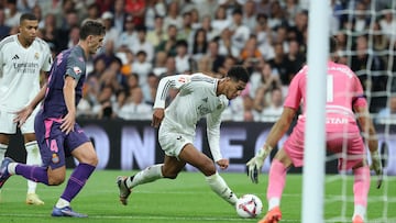 Espanyol's Albanese defender #04 Marash Kumbulla challenges Real Madrid's English midfielder #05 Jude Bellingham during the Spanish league football match between Real Madrid CF and RCD Espanyol at the Santiago Bernabeu stadium in Madrid, on September 21, 2024. (Photo by Thomas COEX / AFP)