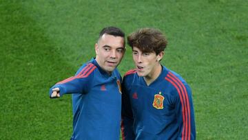 Spain's forward Iago Aspas (L) chats with Spain's defender Alvaro Odriozola as they warm up before the Russia 2018 World Cup Group B football match between Spain and Morocco at the Kaliningrad Stadium in Kaliningrad on June 25, 2018.