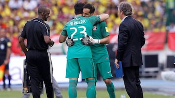 Football Soccer - Colombia v Chile - World Cup 2018 Qualifiers - Roberto Melendez stadium - Barranquilla, Colombia. 11/10/16. Chile&#039;s goalkeepers Johnny Herrera (23) and Claudio Bravo hug each other. REUTERS/John Vizcaino