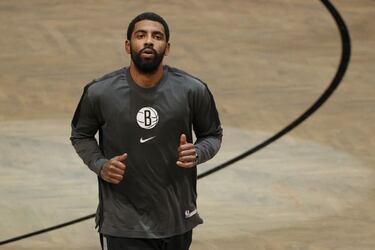Why is Kyrie Irving currently absent from the Brooklyn Nets?