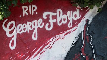 This view shows a detail of a mural memorial in Nantes, western France on June 2, 2020, made in memory of the late George Floyd - a week after the death in the Minneapolis of the unarmed black man who was killed when a white police officer knelt on his ne