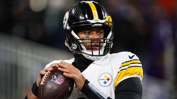 (FILES) Russell Wilson #3 of the Pittsburgh Steelers attempts a pass before the AFC Wild Card Playoff game against the Baltimore Ravens at M&T Bank Stadium on January 11, 2025 in Baltimore, Maryland. The New York Giants and NFL free agent quarterback Russell Wilson have agreed terms on a one-year deal worth up to $21 million, including $10.5 million guaranteed, ESPN reported on March 25, 2025. Wilson, who piloted the Seattle Seahawks to a Super Bowl title in 2013, had reportedly been in talks with the Giants, the Cleveland Browns and the Pittsburgh Steelers. (Photo by Scott Taetsch / GETTY IMAGES NORTH AMERICA / AFP)