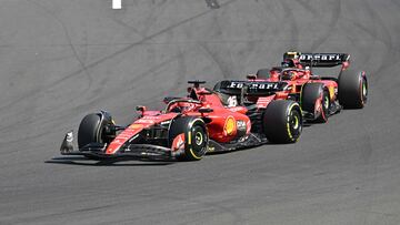 Ferrari's Monegasque driver Charles Leclerc (L) and Ferrari's Spanish driver Carlos Sainz Jr. race during the Formula One Hungarian Grand Prix at the Hungaroring race track in Mogyorod near Budapest on July 23, 2023. (Photo by ATTILA KISBENEDEK / AFP)