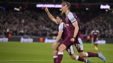 West Ham's Tomas Soucek, right, celebrates after scoring the opening goal of the game during the Europa League round of 16 second leg soccer match between West Ham United and Sevilla at the London stadium in London, Thursday, March 17, 2022. (AP Phot