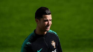 Portugal's forward Cristiano Ronaldo smiles during a training session at Algarve stadium in Faro on November 13, 2019, on the eve of the UEFA Euro 2020 Qualifiers match, Group B, between Portugal and Lithuania. (Photo by PATRICIA DE MELO MOREIRA / AF