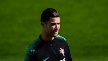 Portugal&#039;s forward Cristiano Ronaldo smiles during a training session at Algarve stadium in Faro on November 13, 2019, on the eve of the UEFA Euro 2020 Qualifiers match, Group B, between Portugal and Lithuania. (Photo by PATRICIA DE MELO MOREIRA / AF