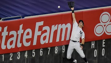 New York Yankees' Mike Tauchman (39) can't make the catch at the wall on a solo home run hit by Boston Red Sox's Xander Bogaerts during the third inning of a baseball game Saturday, Aug. 15, 2020, in New York. (AP Photo/Frank Franklin II)