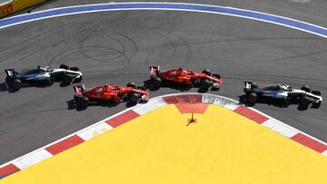 TOPSHOT - From R: Mercedes' Finnish driver Valtteri Bottas, Ferrari's German driver Sebastian Vettel, Ferrari's Finnish driver Kimi Raikkonen and Mercedes' British driver Lewis Hamilton compete in the Formula One Russian Grand Prix at the Sochi Autodrom circuit in Sochi on April 30, 2017. / AFP PHOTO / Andrej ISAKOVIC