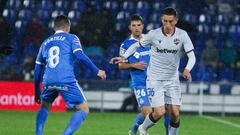 GETAFE, SPAIN - DECEMBER 01: Francisco Portillo,  player of Getafe from Spain and Pablo Martinez, player of Levante from Spain fight for the ball during La Liga  football match,  played between Getafe and Levante at Coliseum Alfonso Perez stadium on Decem