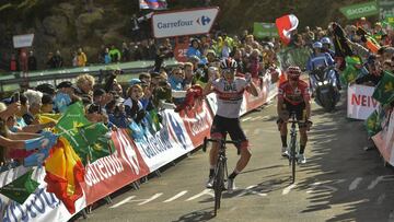 UAE Emirates' Team Tadej Pogacar of Slovenia, left, celebrates after winning the stage beside La Vuelta red shirt leaders, Jumbo -Visma's Team Primoz Roglic of Slovenia at the end of the 13th stage between Bilbao-Los Machucos Monumento Vaca Pasiega, 166,4 km kilometers (103,39miles), of the Spanish Vuelta cycling race that finishes Los Machucos, near to San Roque de Riomiera, northern Spain, Friday, Sept. 6, 2019. (AP Photo/Alvaro Barrientos)