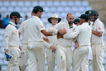 Australia's Nathan Lyon (centre) celebrates with team-mates after his dismissal of Sri Lanka's Dhananjaya de Silva.