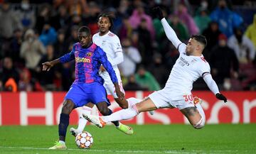 Ousmane Dembélé y Nicolás Otamendi.