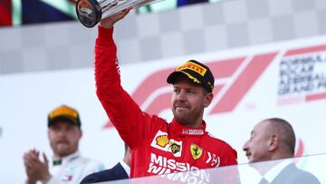 BAKU, AZERBAIJAN - APRIL 28: Third placed finisher Sebastian Vettel of Germany and Ferrari celebrates on the podium during the F1 Grand Prix of Azerbaijan at Baku City Circuit on April 28, 2019 in Baku, Azerbaijan. (Photo by Dan Istitene/Getty Images)