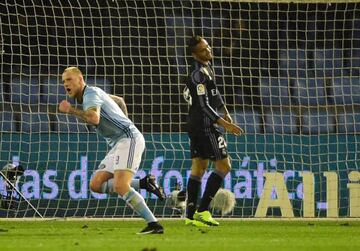 Guidetti (left) wheels away as Danilo laments his own goal.