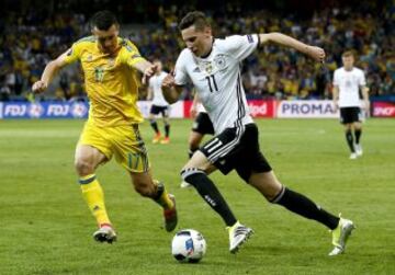 Artem Fedetskiy of Ukraine y Julian Draxler