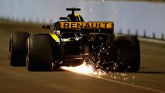 SINGAPORE - SEPTEMBER 15: Sparks fly behind Nico Hulkenberg of Germany driving the (27) Renault Sport Formula One Team RS18 on track during qualifying for the Formula One Grand Prix of Singapore at Marina Bay Street Circuit on September 15, 2018 in Singapore.  (Photo by Charles Coates/Getty Images)