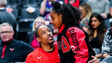 TORONTO, CANADA - APRIL 12:  DeMar DeRozan #11 of the Chicago Bulls embraces his daughter before the game against the Toronto Raptors during the 2023 Play-In Tournament on April 12, 2023 at the Scotiabank Arena in Toronto, Ontario, Canada.  NOTE TO USER: User expressly acknowledges and agrees that, by downloading and or using this Photograph, user is consenting to the terms and conditions of the Getty Images License Agreement.  Mandatory Copyright Notice: Copyright 2022 NBAE (Photo by Mark Blinch/NBAE via Getty Images)