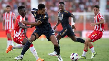 Almeria's Ghanaian midfielder #04 Iddrisu Baba vies with Real Madrid's British defender #05 Jude Bellingham during the Spanish Liga football match between UD Almeria and Real Madrid CF at the Municipal Stadium of the Mediterranean Games in Almeria on August 19, 2023. (Photo by JORGE GUERRERO / AFP)