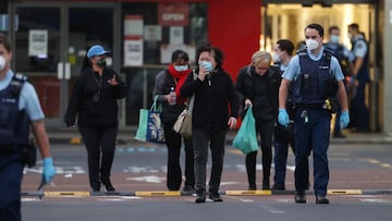 AUCKLAND, NEW ZEALAND - SEPTEMBER 03: Police escort people from LynnMall to their cars after a violent extremist took out a terrorist attack stabbing six people before being shot by police on September 03, 2021 in Auckland, New Zealand. A man has been killed by police after injuring multiple people in a mass stabbing incident at LynnMall supermarket in West Auckland. Prime Minster Jacinda Ardern has addressed the country describing the attack as violent and senseless. (Photo by Fiona Goodall/Getty Images)