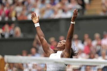 Williams falls to the floor as she celebrates beating Kerber.