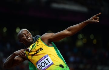 Usain Bolt strikes his famous pose after winning the men's 100m final at the London 2012 Olympic Games on August 5, 2012.