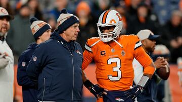 Dec 24, 2023; Denver, Colorado, USA; Denver Broncos head coach Sean Payton talks with quarterback Russell Wilson (3) before the game against the New England Patriots at Empower Field at Mile High. Mandatory Credit: Isaiah J. Downing-USA TODAY Sports