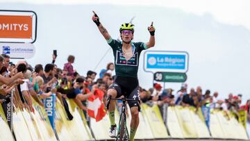 Team Bora's Slovenian rider Primoz Roglic, wearing the sprinter's green jersey, celebrates as he crosses the finish line to win the sixth stage of the 76th edition of the Criterium du Dauphine cycling race, 174,1km between Hauterives and Le Collet d'Allevard, French Alps, on June 7, 2024. (Photo by Thomas SAMSON / AFP)