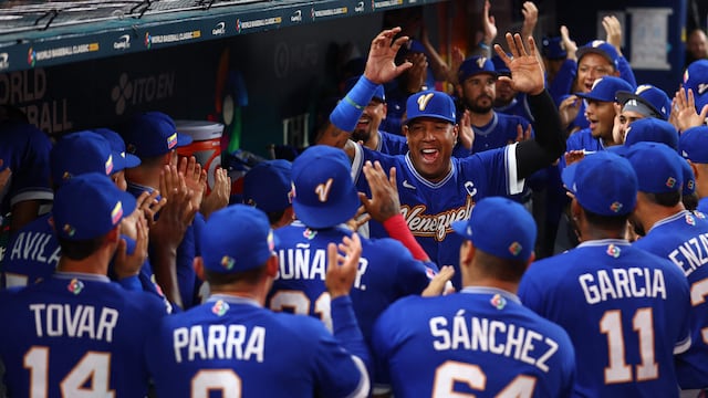 MIAMI, FLORIDA - MARCH 16: Salvador Perez #13 of Team Venezuela dances in the dugout with teammates before the game against Team Italy at loanDepot park on March 16, 2026 in Miami, Florida. Megan Briggs/Getty Images/AFP (Photo by Megan Briggs / GETTY IMAGES NORTH AMERICA / Getty Images via AFP)