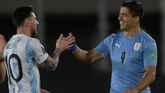 Argentina&#039;s Lionel Messi (L) greets Uruguay&#039;s Luis Suarez before the start of the South American qualification football match for the FIFA World Cup Qatar 2022, at the Monumental stadium in Buenos Aires, on October 10, 2021. (Photo by Juan Mabro