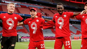 MUNICH, GERMANY - MAY 08: (L-R) Ron-Thorben Hoffmann, Marc Roca, Tanguy Nianzou, Joshua Kimmich, Manuel Neuer and Javi Martinez of Bayern Muenchen celebrate winning the league title after the Bundesliga match between FC Bayern Muenchen and Borussia Moench