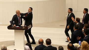 Turkey's AK Party lawmaker Alpay Ozalan scuffles with Workers' Party of Turkey (TIP) lawmaker Ahmet Sik, who was speaking during an extraordinary meeting of the Turkish parliament to discuss jailed opposition lawmaker Can Atalay's return to the assembly, in Ankara, Turkey August 16, 2024. REUTERS/Cagla Gurdogan TPX IMAGES OF THE DAY