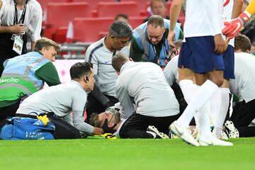 Luke Shaw receives medical attention after colliding with Carvajal.