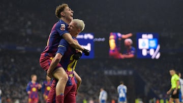 Barcelona's Spanish midfielder #20 Daniel Olmo (R) celebrates with Barcelona's Spanish midfielder #16 Fermin Lopez after scoring a goal during the Spanish League football match between RCD Espanyol and FC Barcelona at�RCDE Stadium in Cornella de Llobregat on January 3, 2026. (Photo by MANAURE QUINTERO / AFP)