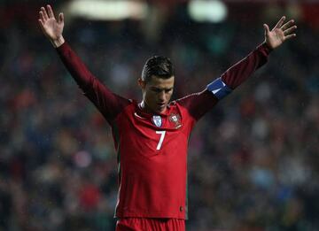 Portugal's forward Cristiano Ronaldo celebrates after scoring a goal during the FIFA 2018 World Cup Qualifier match between Portugal and Hungary