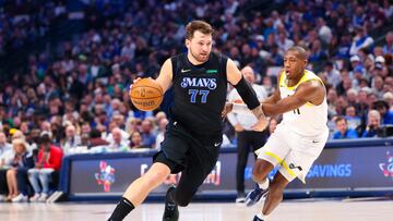 Dallas Mavericks guard Luka Doncic (77) drives to the basket past Utah Jazz guard Kris Dunn (11) during the first half at American Airlines Center.