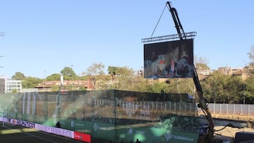 Betis hang their scoreboard from a crane