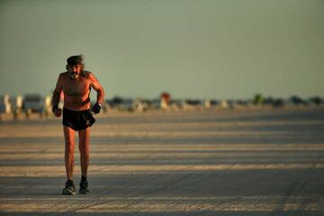 Robert "Raven" Kraft runs alone on the closed beach after being granted special permission by city officials on April 2, 2020 in Miami Beach, Florida.